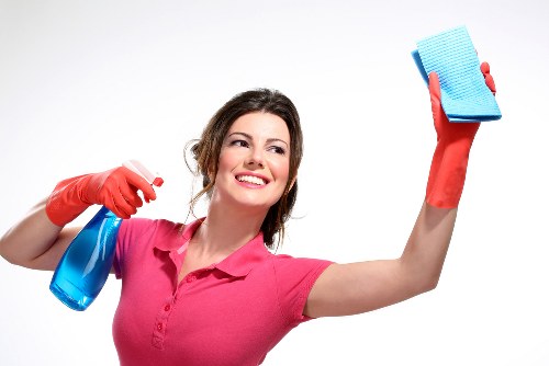 Experienced cleaner in Putney maintaining a tidy office and workspace